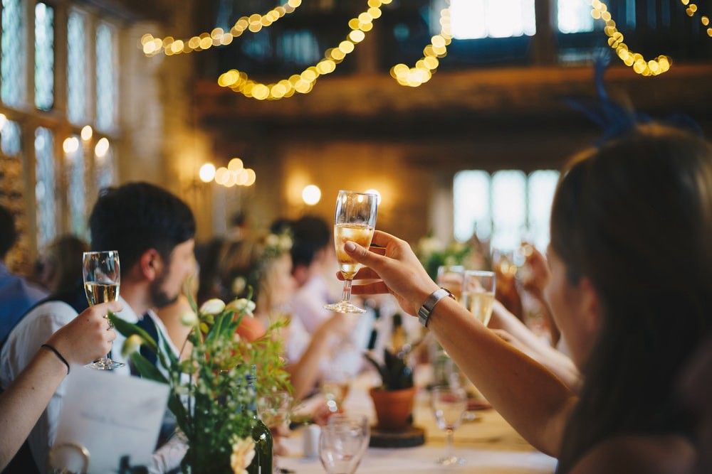 employees toasting in a party - Member Appreciation Ideas