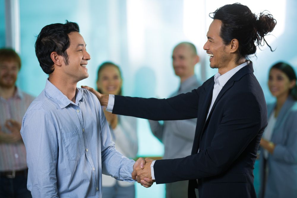 man getting a pat on the back - how to recognize employees for a job well done