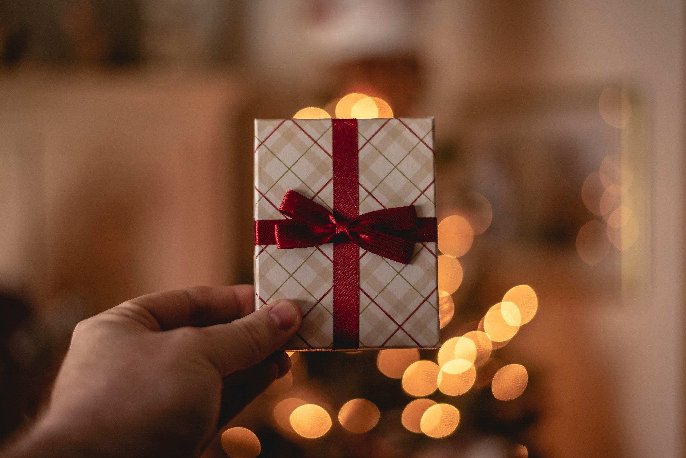 person holding a gift - Seamless Gifting Experiences