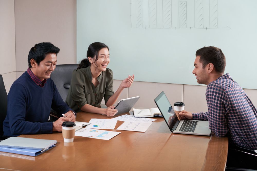 side view of three people at the business meeting