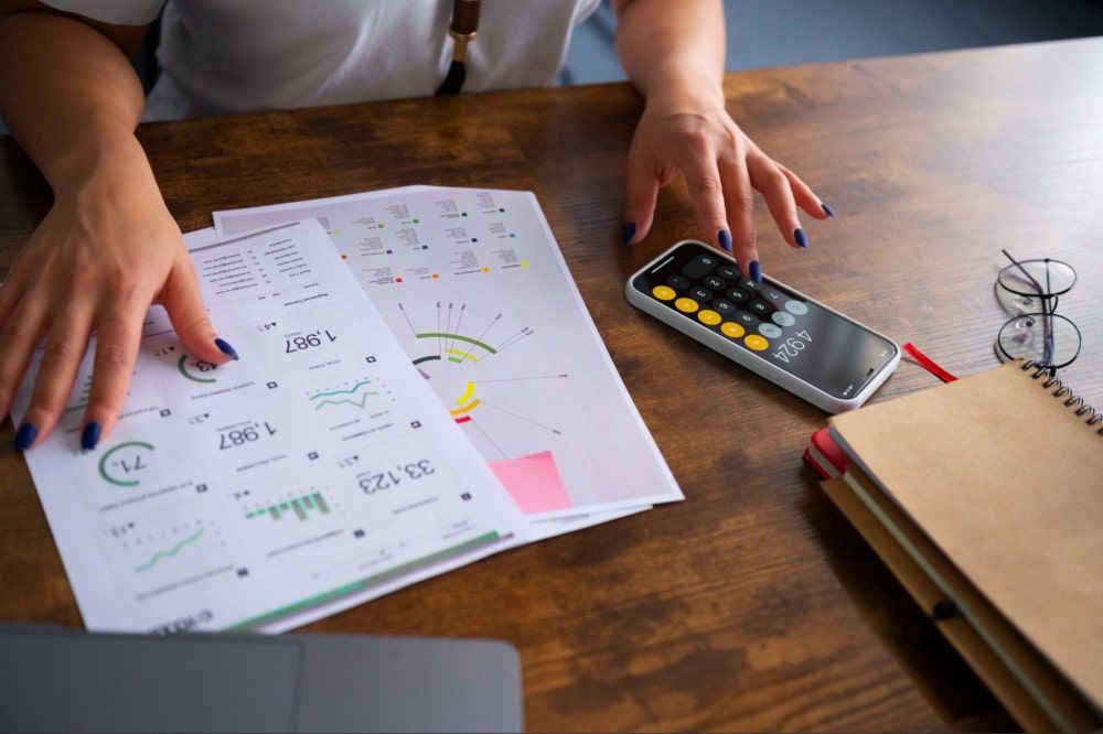 woman with calculator - How To Measure Customer Loyalty