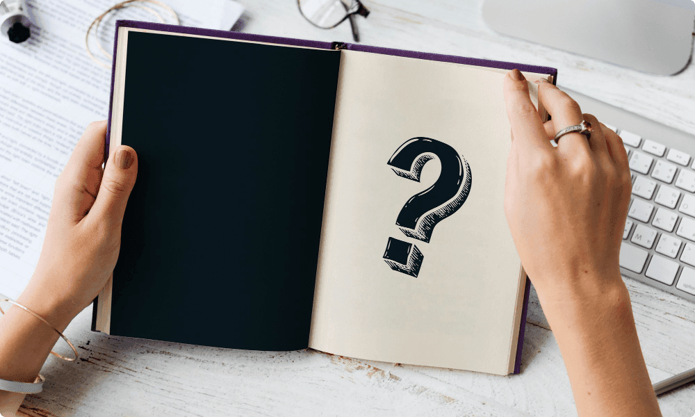 question mark on book - Fun Onboarding Questions for New Hires